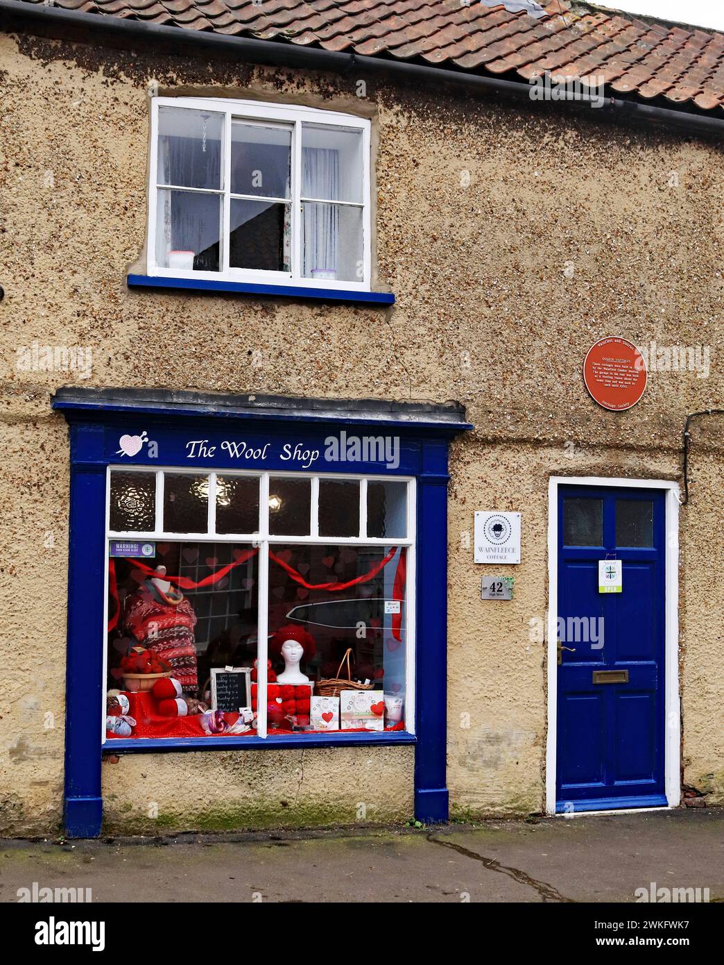 On the High Street in Wainfleet stand’s the Wainfleece cottage wool shop in a former cottage, one of few little village wool shops left in the uk Stock Photo