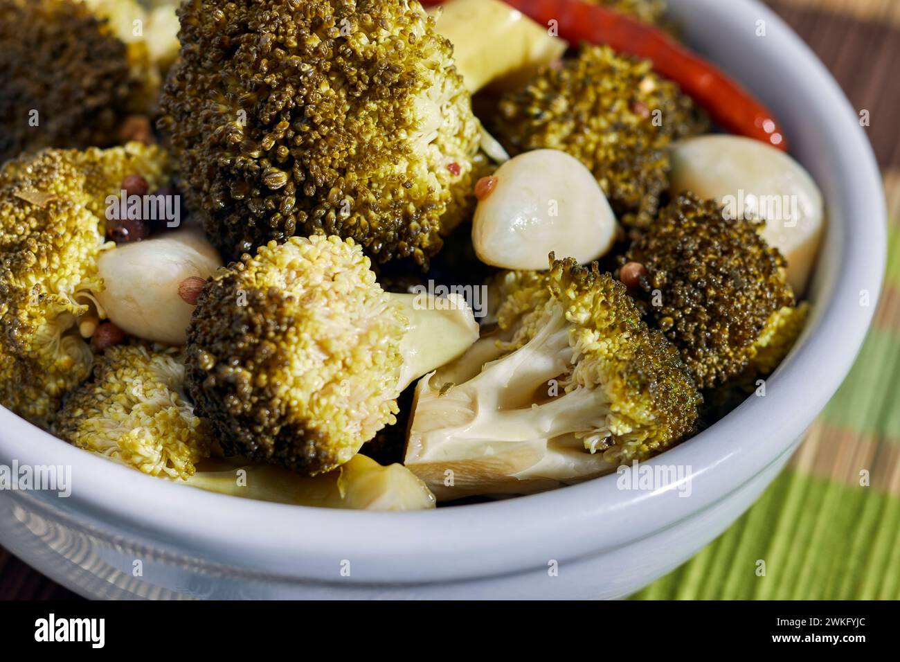 Pickled broccoli florets with garlic and chili pepper Stock Photo - Alamy
