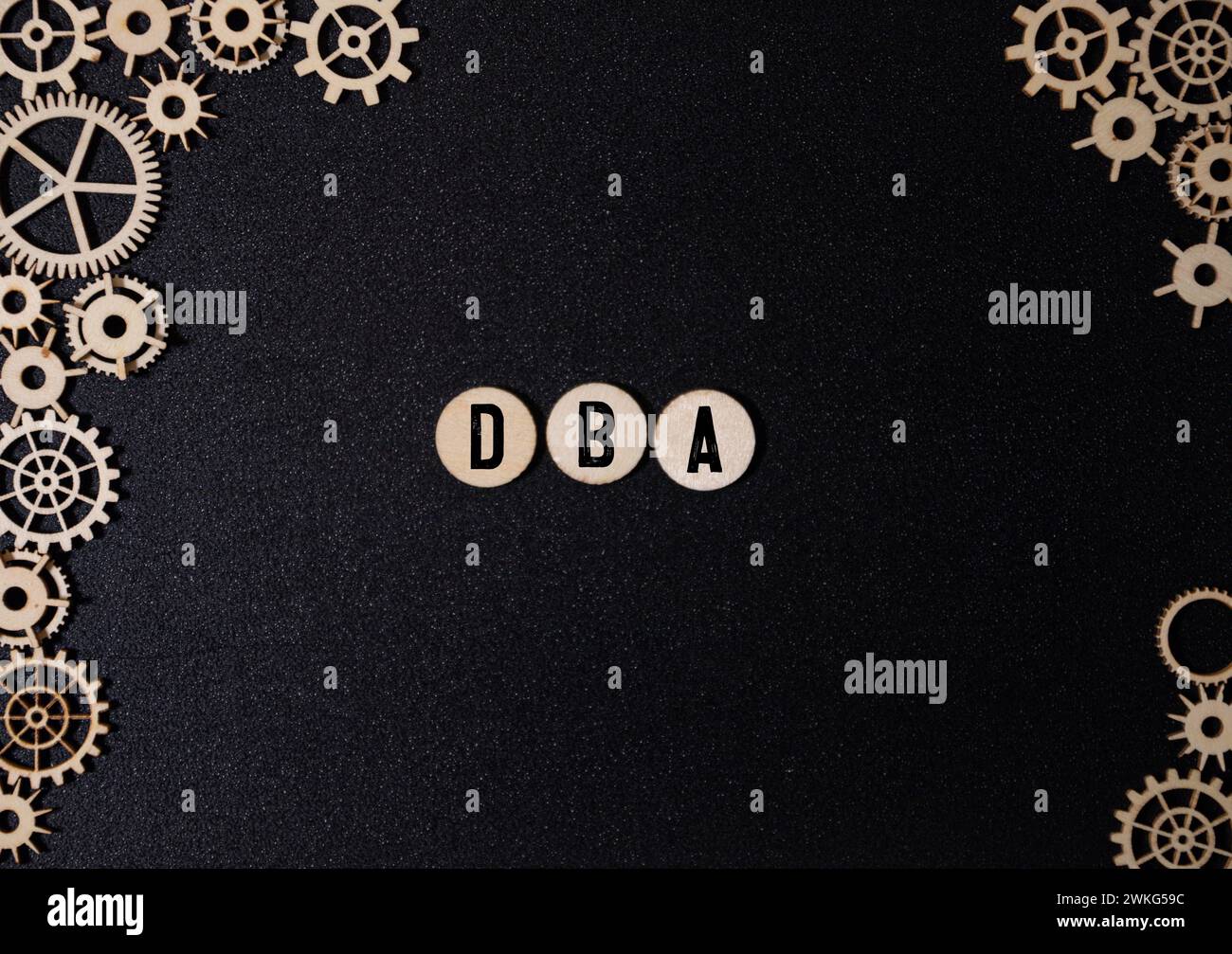 DBA text assembled from wooden cubes on a black background Stock Photo ...