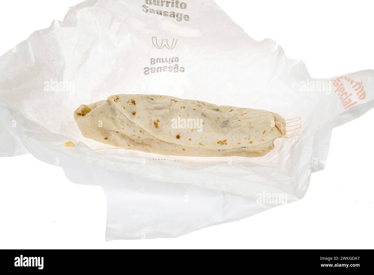Winneconne, WI - 20 February 2024: A package of McDonalds sausage burrito on a wrapper on an isolated background. Stock Photo