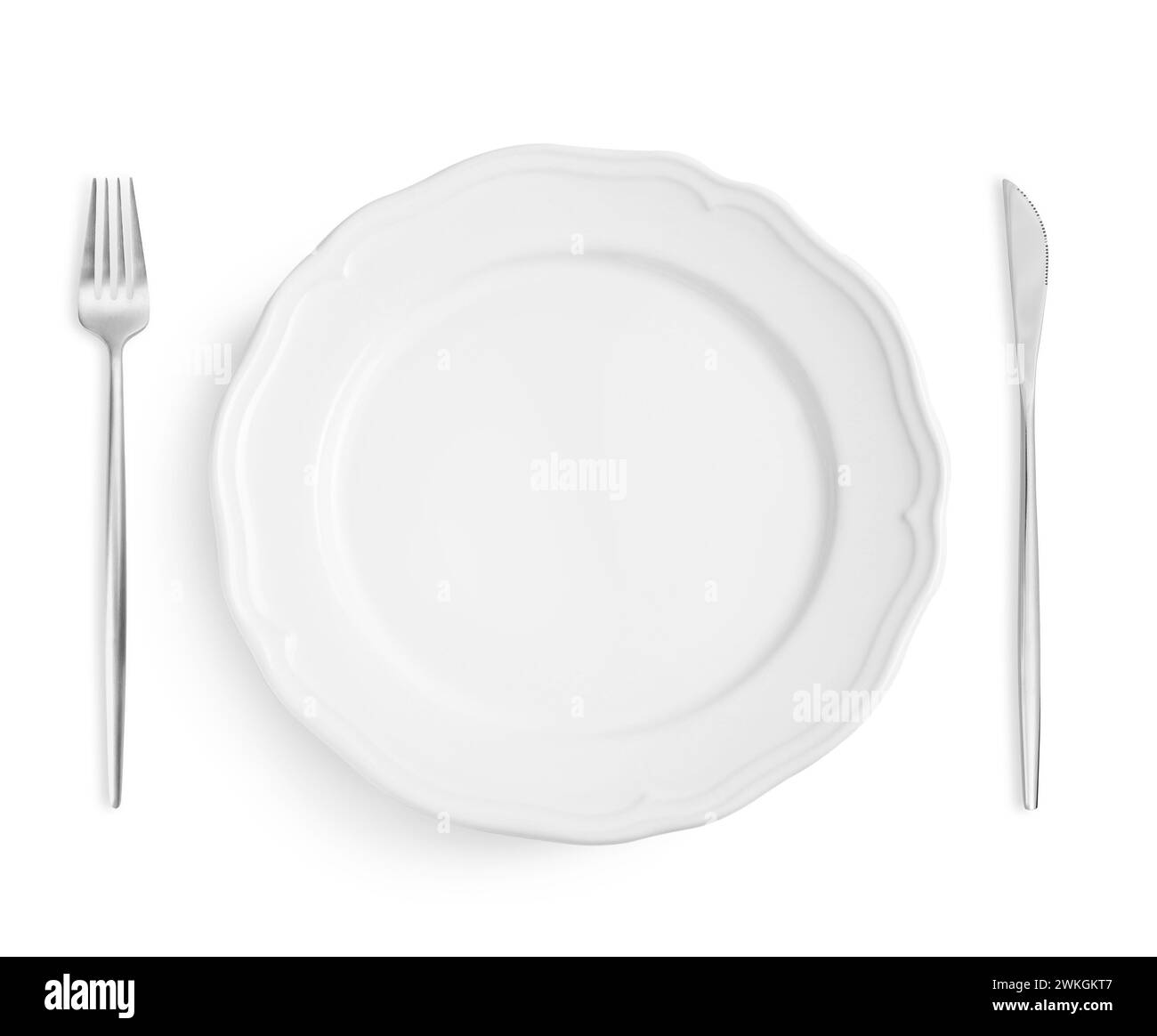 Clean plate, fork and knife on white background, top view Stock Photo ...