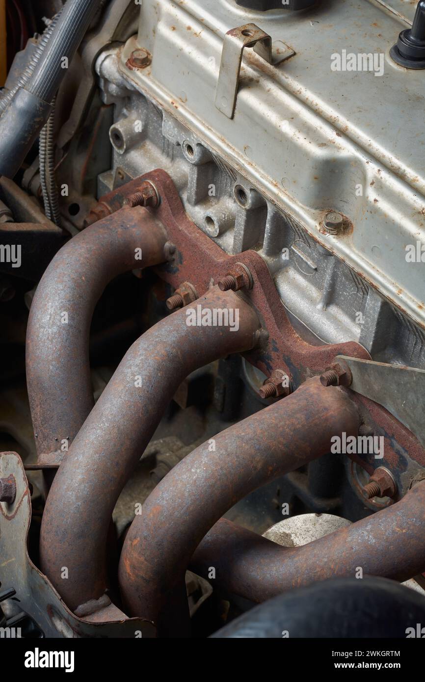 used exhaust manifold of four cylinder car engine, component of internal combustion engine