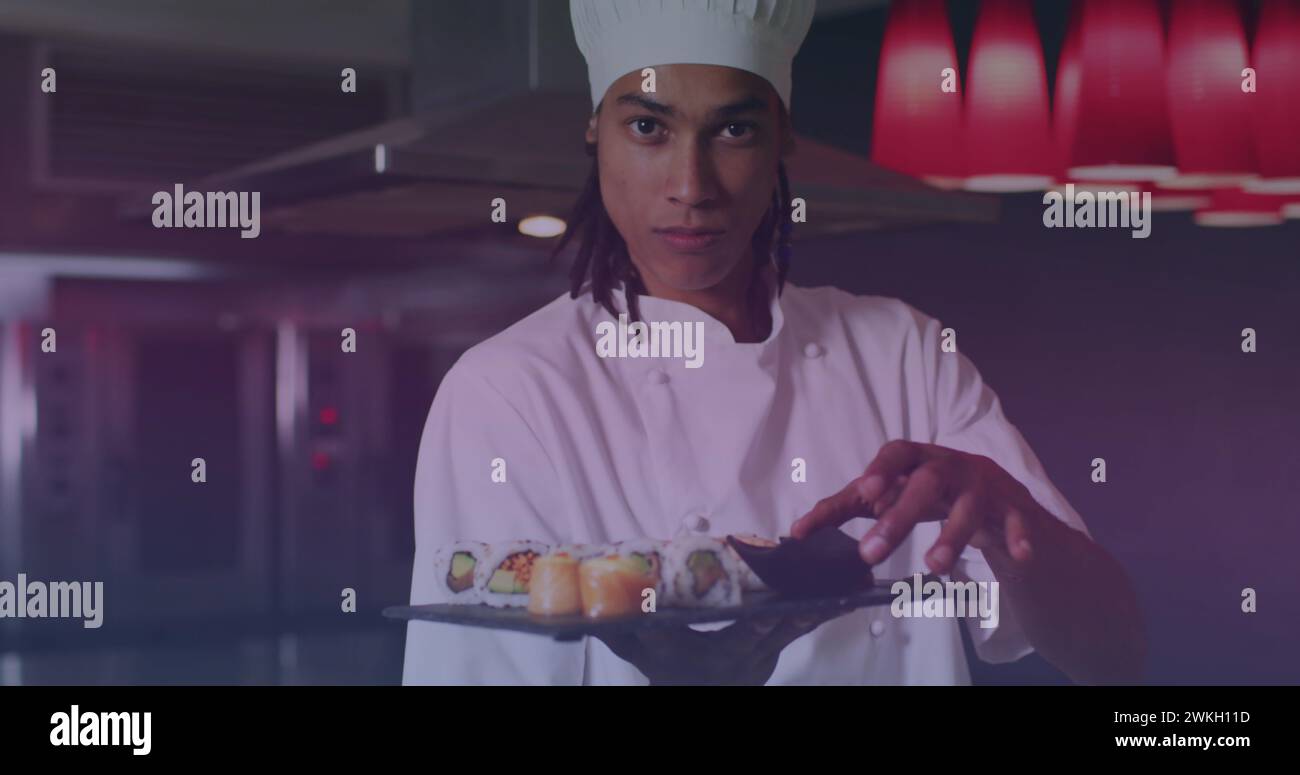 Image of biracial male chef preparing sushi Stock Photo