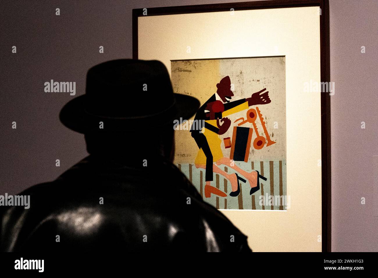 A visitor examines 'Jitterbugs II' painting by artist William H. Johnson on view at upcoming Harlem Renaissance Exhibition at The Metropolitan Museum in New York during press preview on February 20, 2024 Stock Photo
