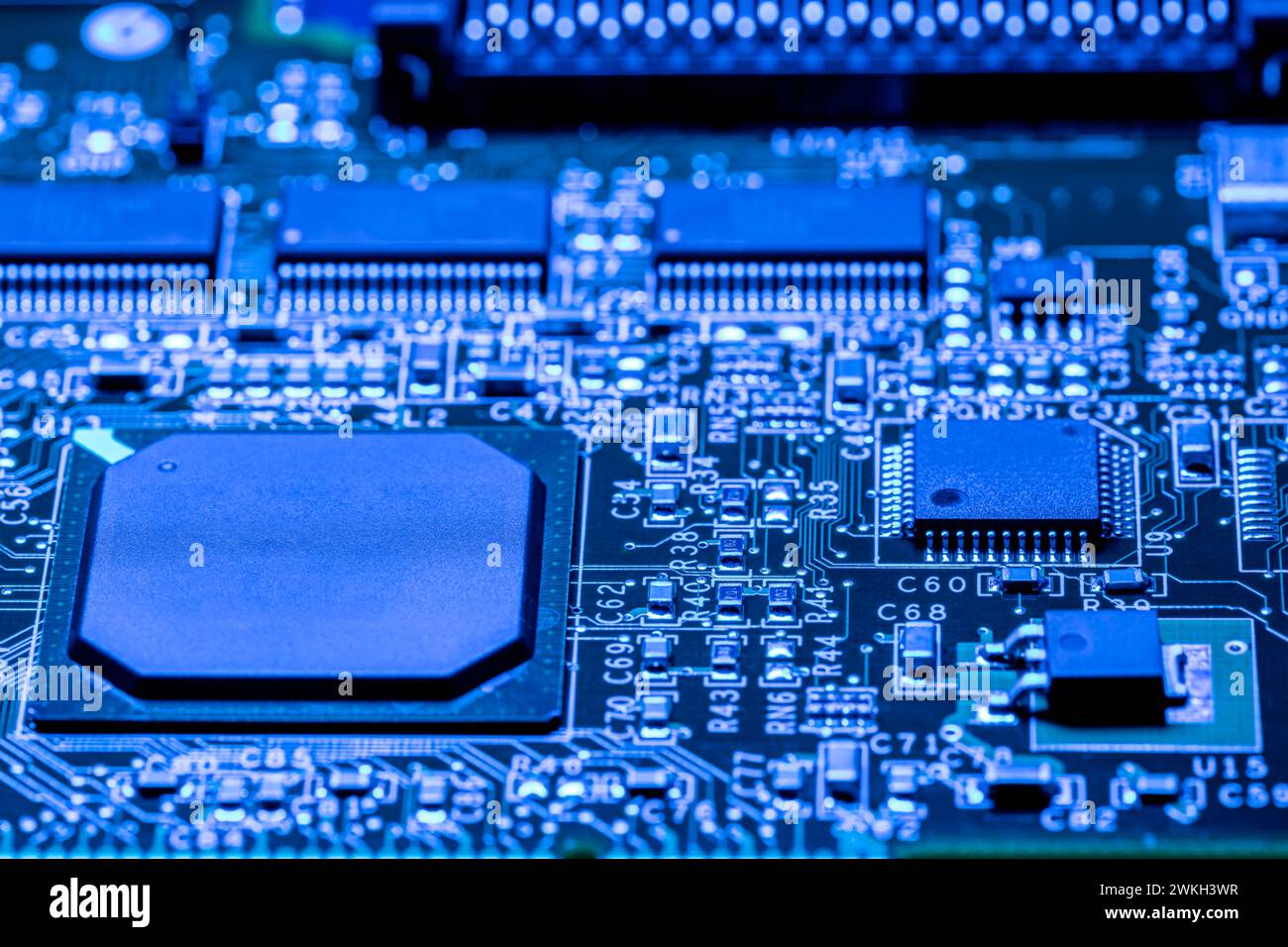 computer circuit board with chips and different electronic components. toned blue. closeup view. Stock Photo