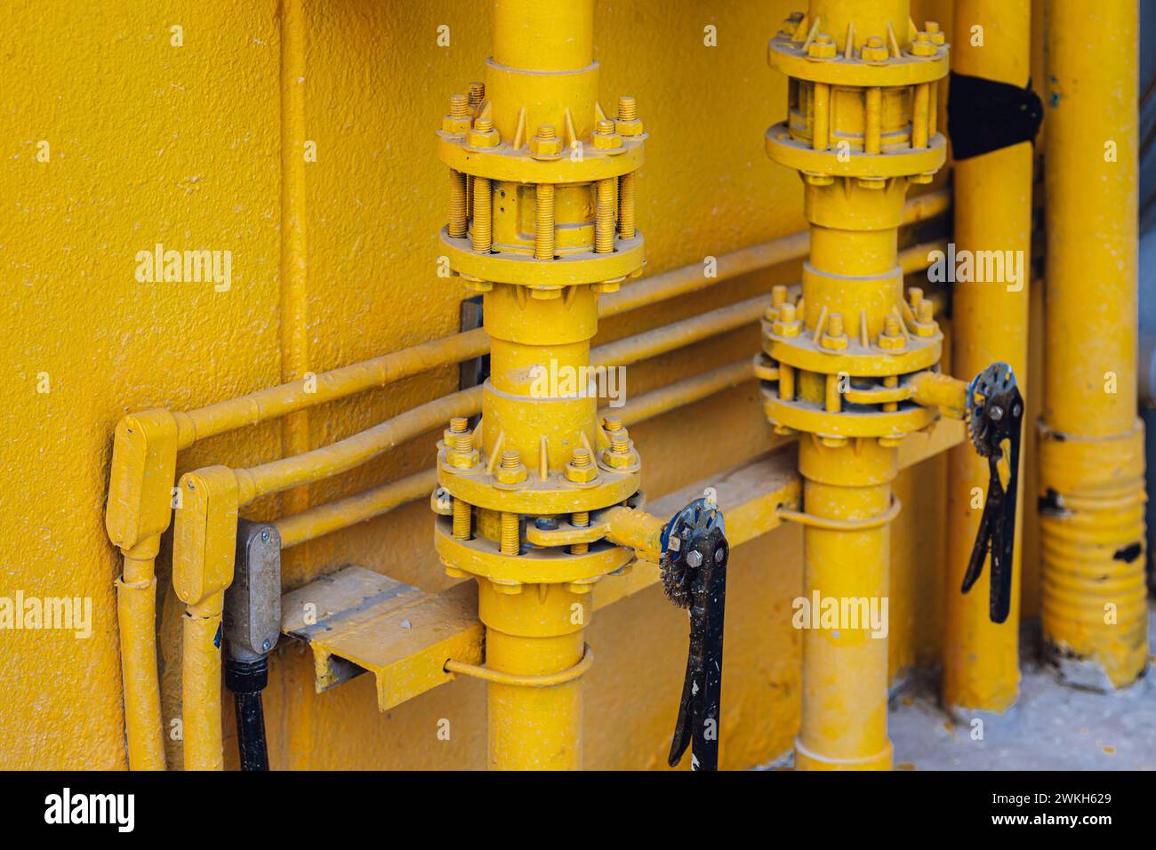 water pipe join with connector hand valve paint yellow color for rusty protection and decoration Stock Photo