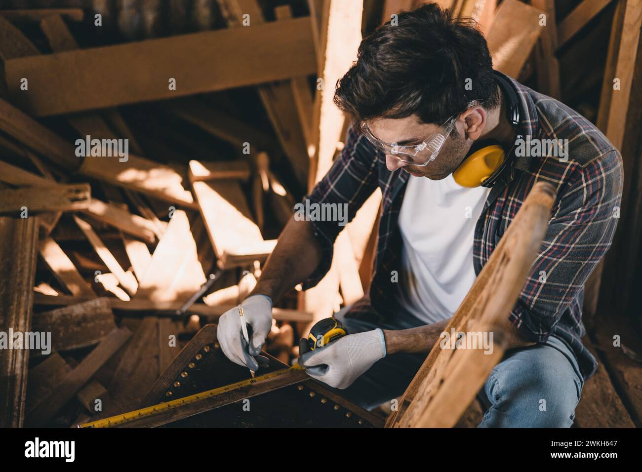 professional carpenter man hand working make wooden handcraft furniture master workpiece fine detail artisan with wood workshop. Stock Photo
