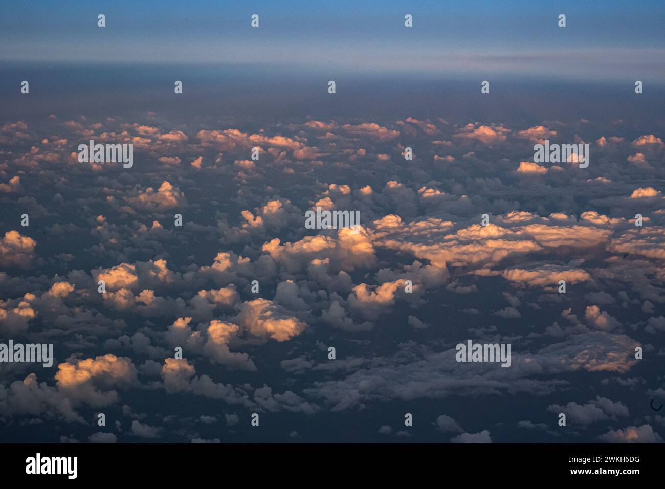 Beautiful sunset sky above clouds with dramatic light. Cabin view from ...