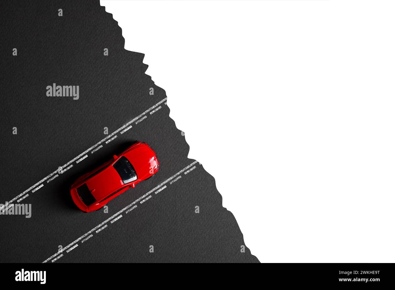 A car stopped on the road ending at the edge of a cliff. Failure, wrong choice concept Stock Photo