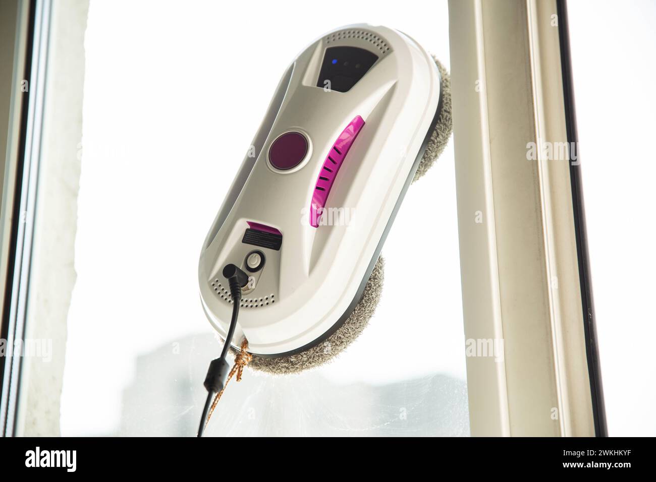 Modern device for cleaning glass from dirt and streaks. Robot washer