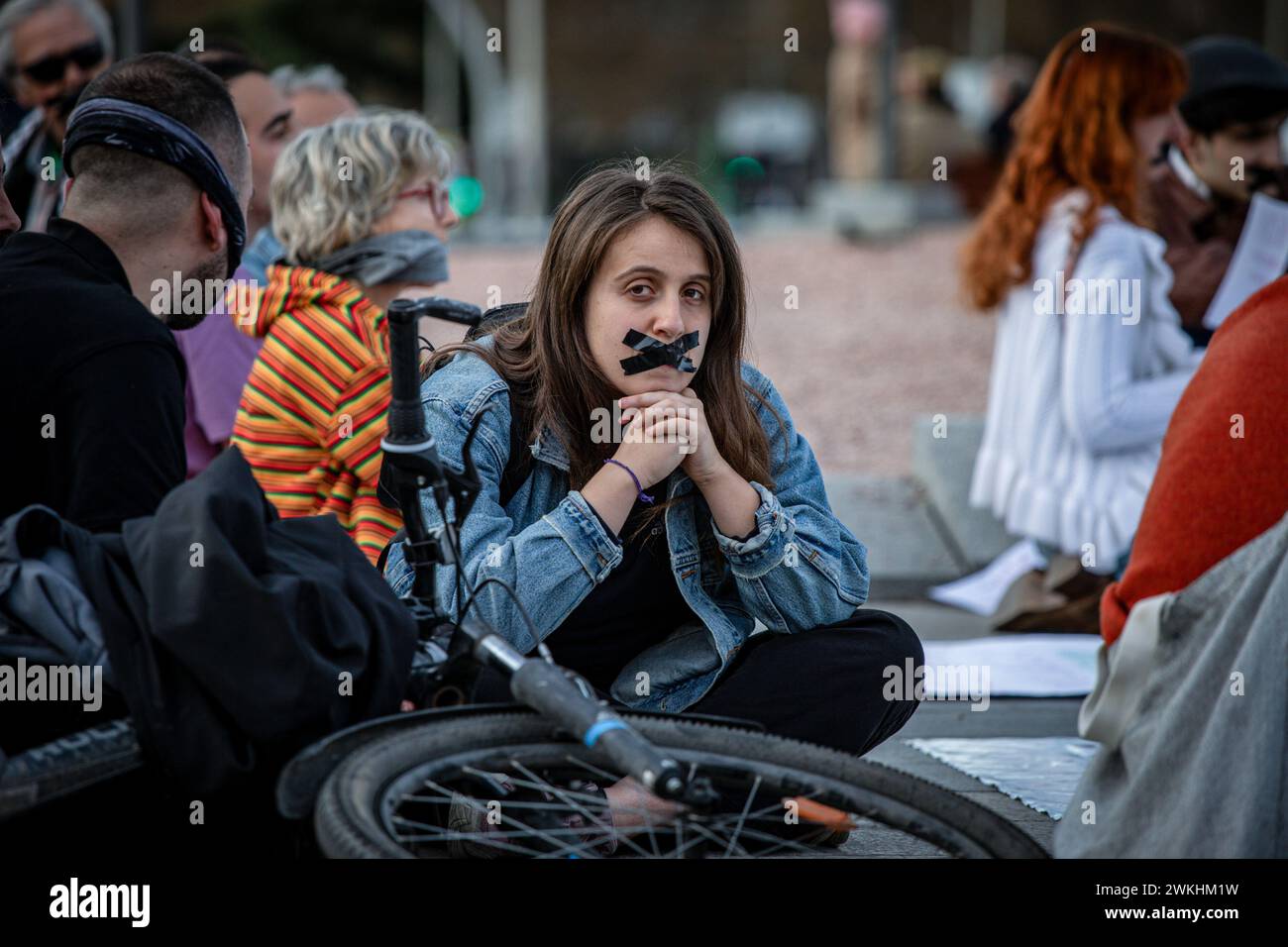 Madrid, Spain. 20th Feb, 2024. An activist sitting on the ground with