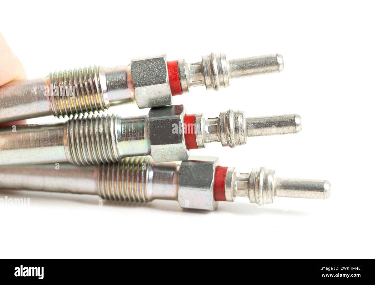 Modern ceramic glow plugs for warming up a diesel engine before starting. White background, isolate. Macro, engine start Stock Photo