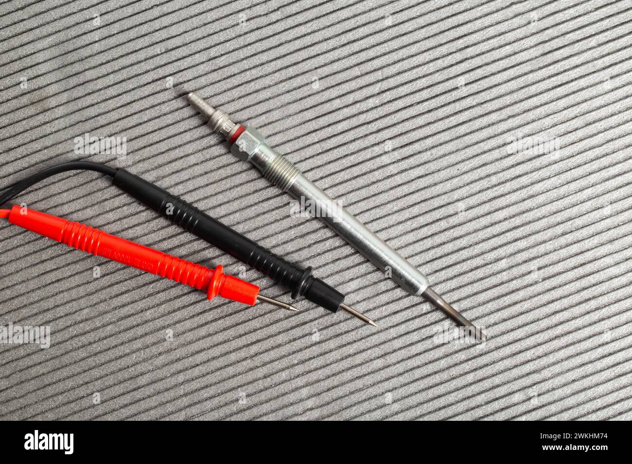 Checking the serviceability of the glow plug with a multimeter. Glow