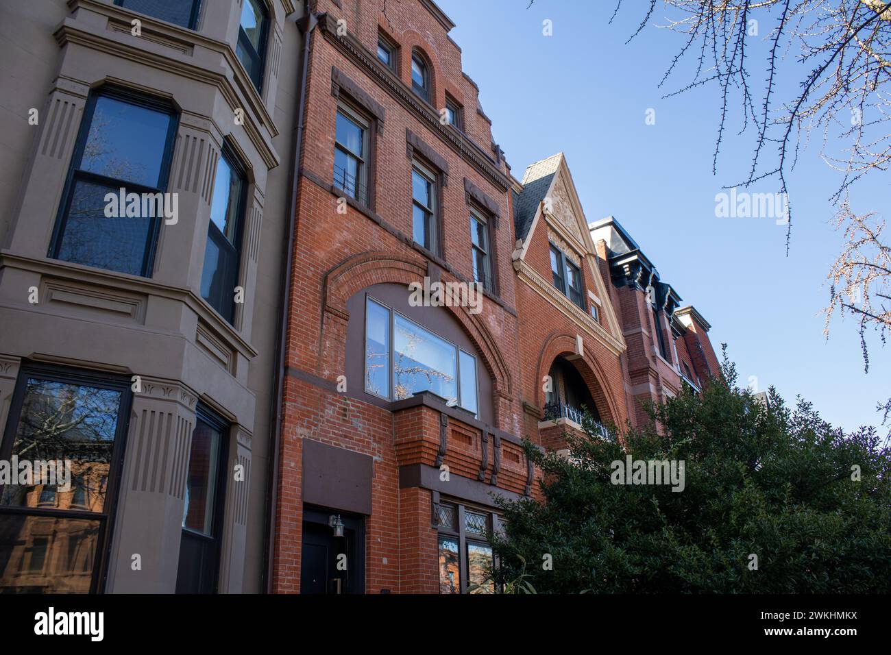 The multiple rows of houses line a vibrant street in New York, United States Stock Photo