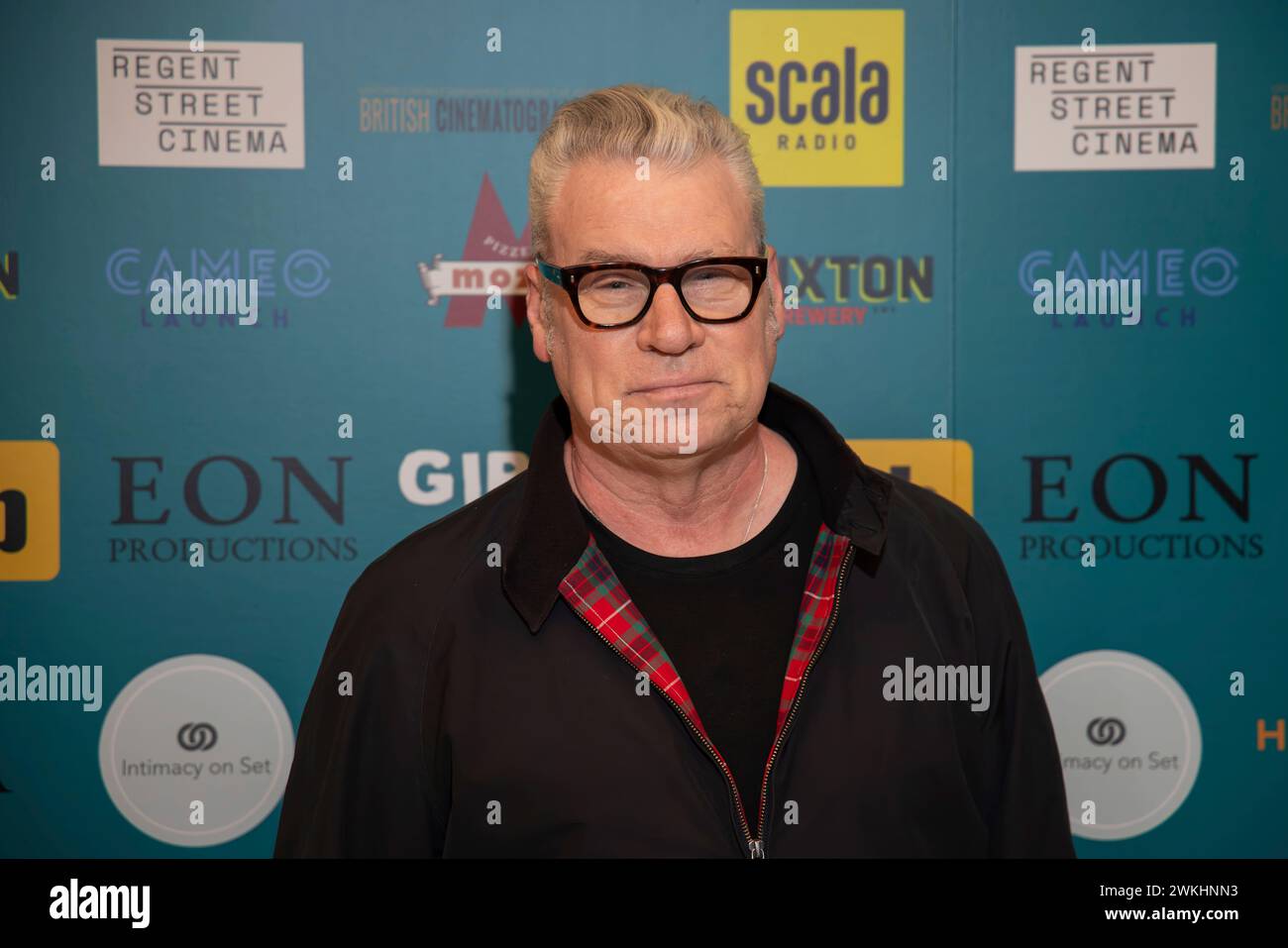 Mark Kermode poses for photographers upon arrival at the Girls on Film