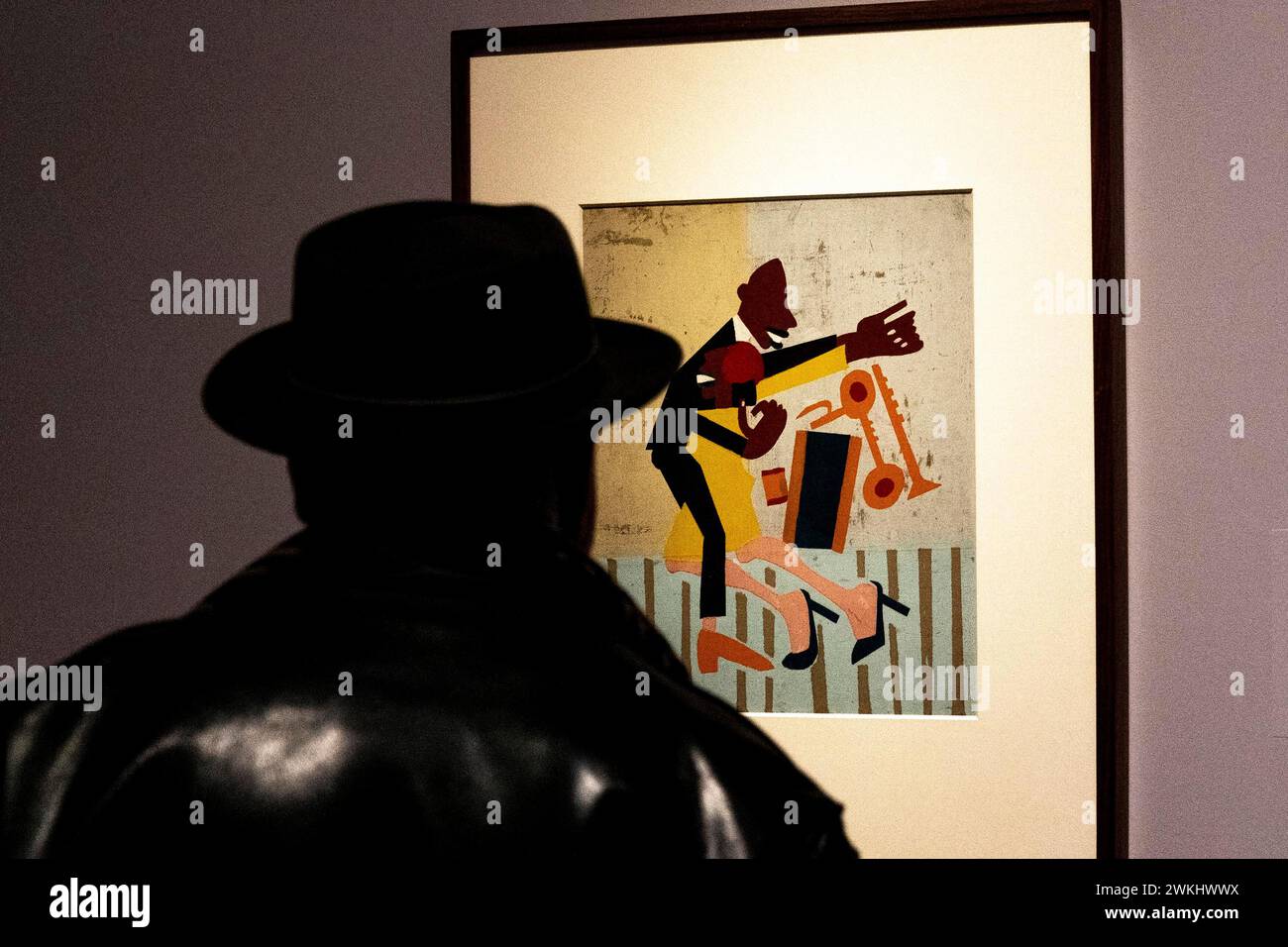 New York, New York, USA. 20th Feb, 2024. A visitor examines 'Jitterbugs II' painting by artist William H. Johnson on view at upcoming Harlem Renaissance Exhibition at The Metropolitan Museum in New York during press preview on February 20, 2024. Exhibition showcases the first African American movement of international modern art reaching across the Atlantic and influencing some famous artists such as Munch, Picasso and Matisse. (Credit Image: © Lev Radin/ZUMA Press Wire) EDITORIAL USAGE ONLY! Not for Commercial USAGE! Stock Photo