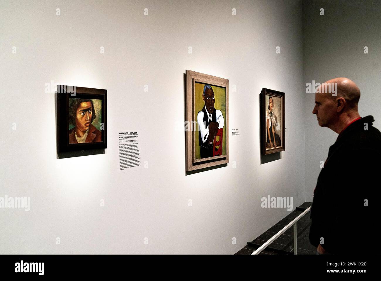 New York, New York, USA. 20th Feb, 2024. A visitor looking at paintings by William H. Johnson 'Man in a Vest' on view at upcoming Harlem Renaissance Exhibition at The Metropolitan Museum in New York during press preview on February 20, 2024. Exhibition showcases the first African American movement of international modern art reaching across the Atlantic and influencing some famous artists such as Munch, Picasso and Matisse. (Credit Image: © Lev Radin/ZUMA Press Wire) EDITORIAL USAGE ONLY! Not for Commercial USAGE! Stock Photo