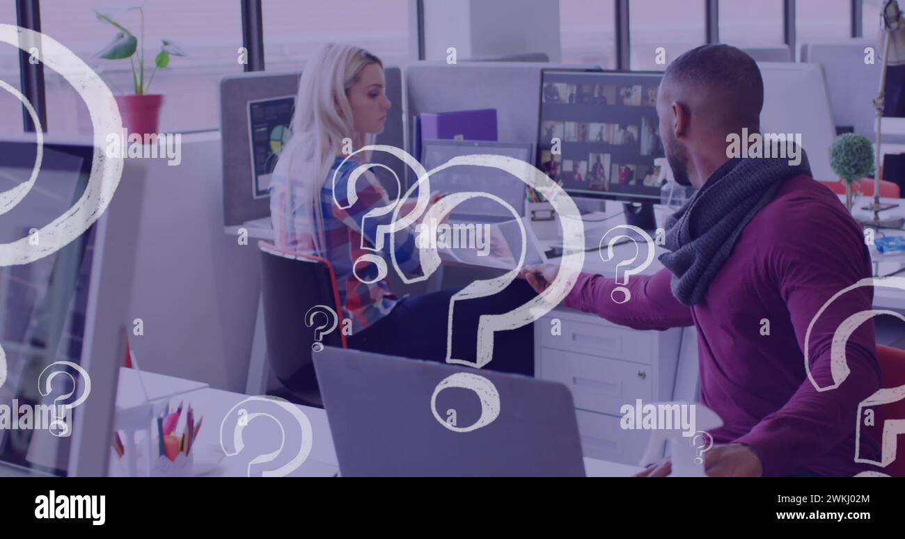 Image of question marks icons over diverse business people holding ...