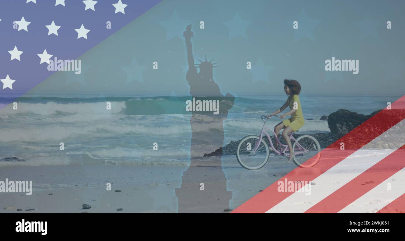 Image of american flag revealing statue of liberty and woman riding bike on beach Stock Photo