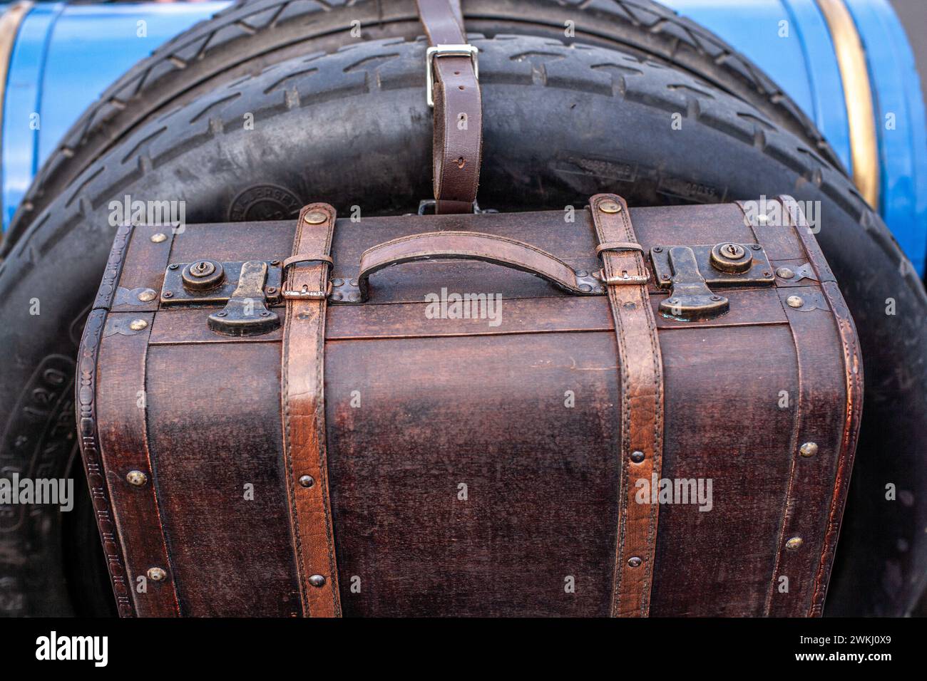 Spare wheel and suitcase on the rear of the car. Stock Photo