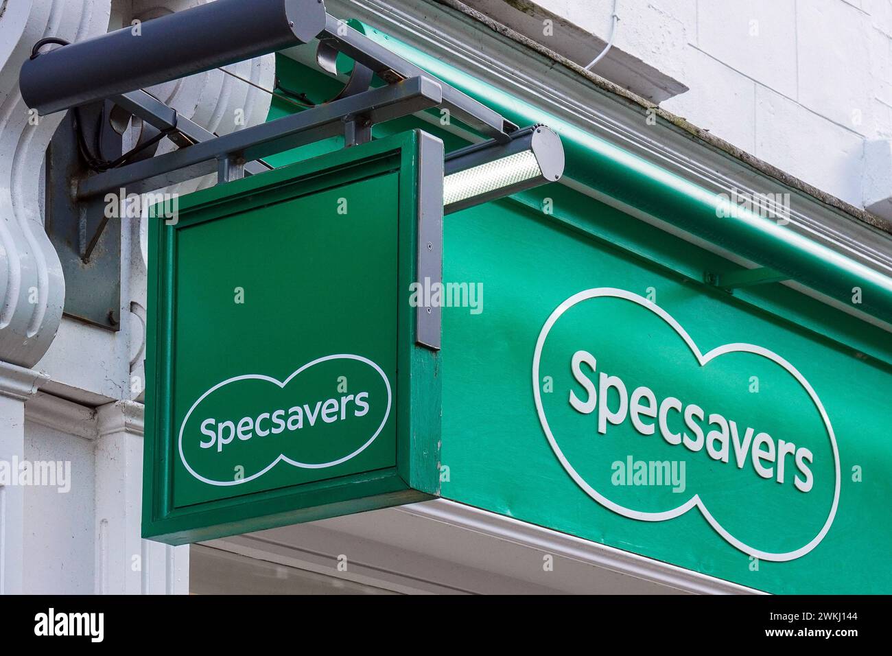Hanging sign and shop banner sign for SPECSAVERS opticians outlet. Ayr. UK Stock Photo