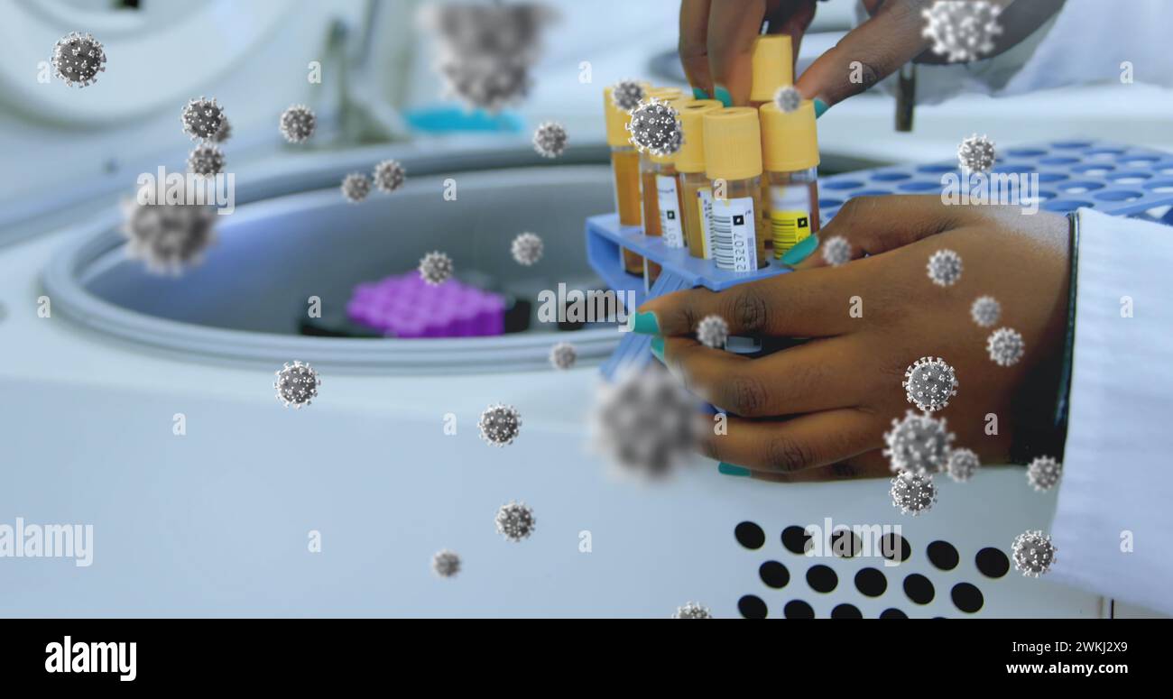 Image of floating macro Covid-19 cells over biracial doctor checking ...