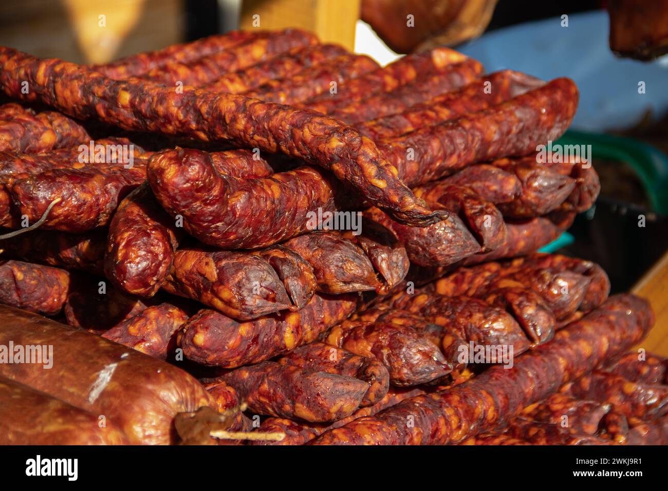 Serbian traditionally made and smoke dried sausages on a farmer's market in Kacarevo village, gastro bacon and dry meat products festival held yearly Stock Photo