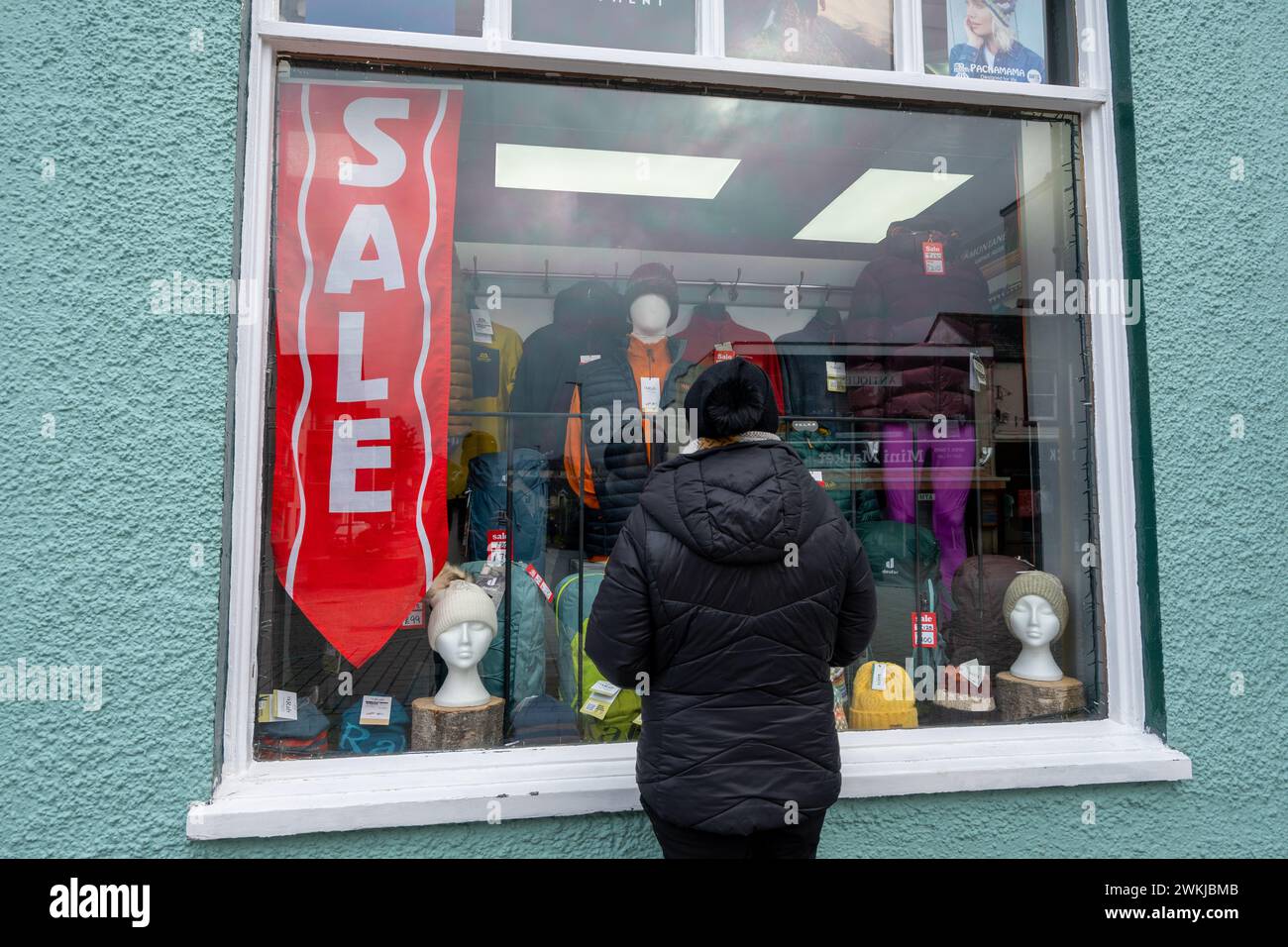 Red sale sign in a local shop window Keswick Lake district Cumbria. Stock Photo