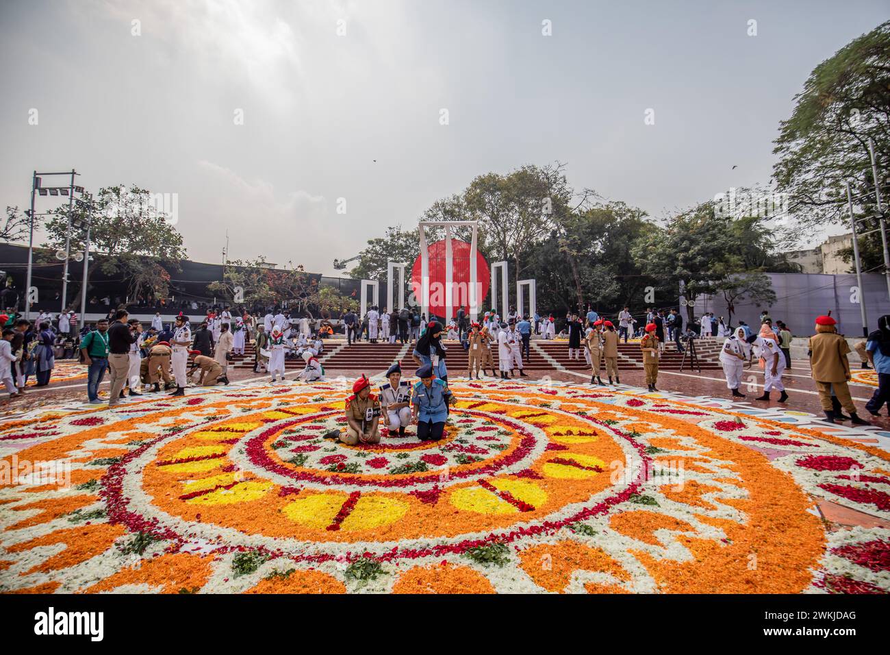 Dhaka, Bangladesh. 21st Feb, 2024. Volunteers arrange flower petals