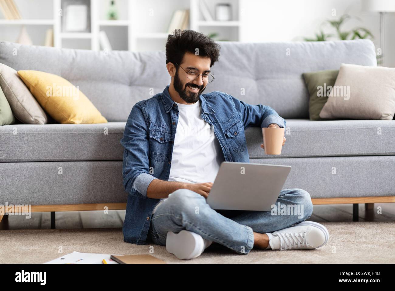 Indian man sitting cross legged hi-res stock photography and images - Alamy