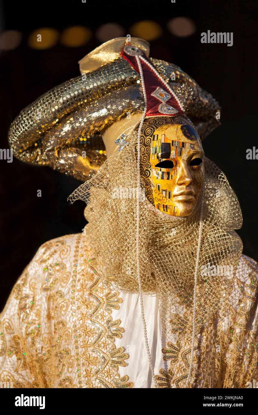 A Venice carnival mask in St. Marks square, Venice, Veneto, Italy. Stock Photo