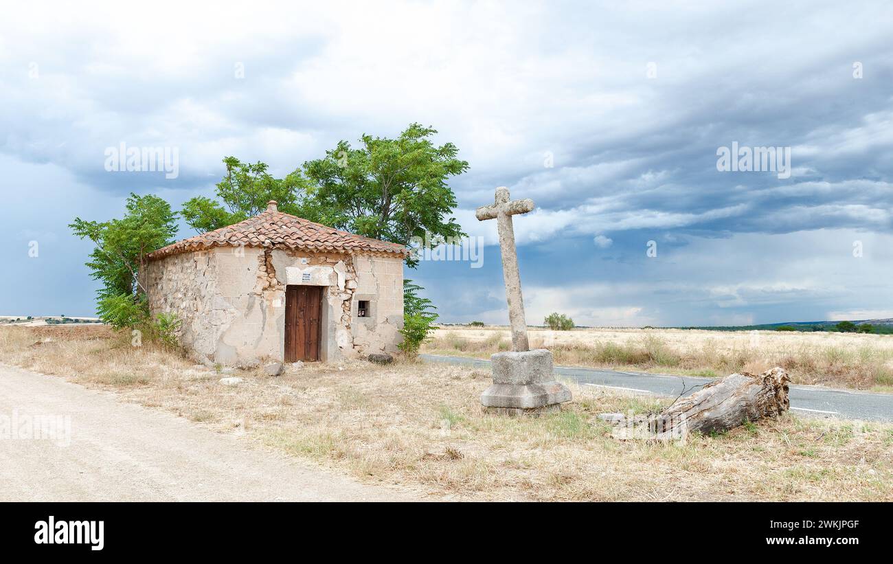 stone cross on dark sky background with Stock Photo