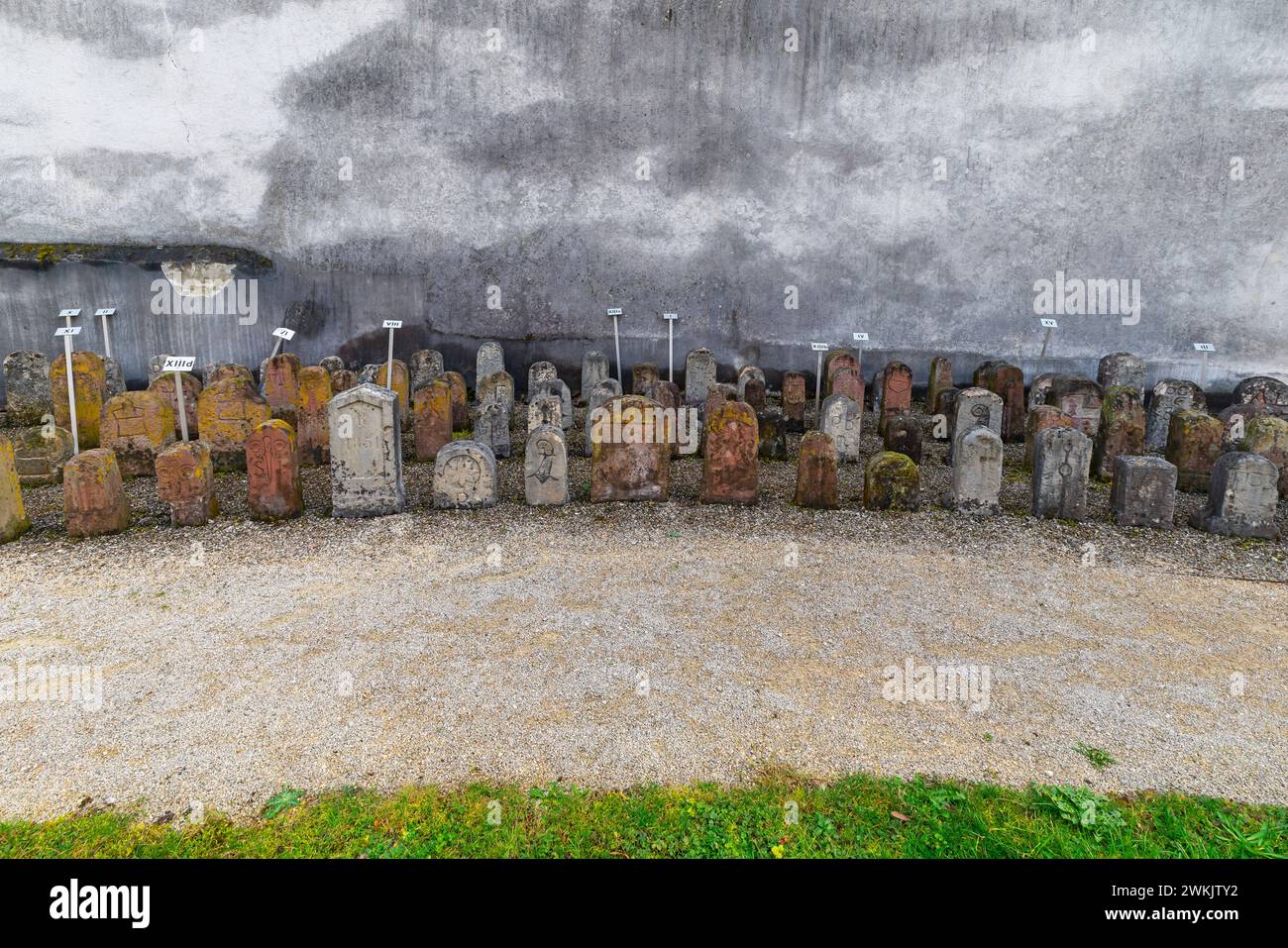 The border stones of Muttenz by the fortification surrounding the fortified Church of Saint Arbogast at municipality of Muttenz. Canton of  Basel-Land Stock Photo