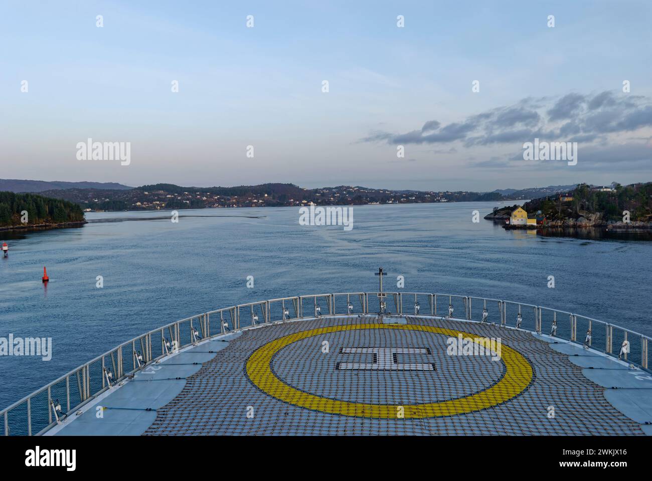 A Seismic Research Vessel heading up the Fjord towards the Norwegian Coastal City of Bergen, early one morning in April. Stock Photo
