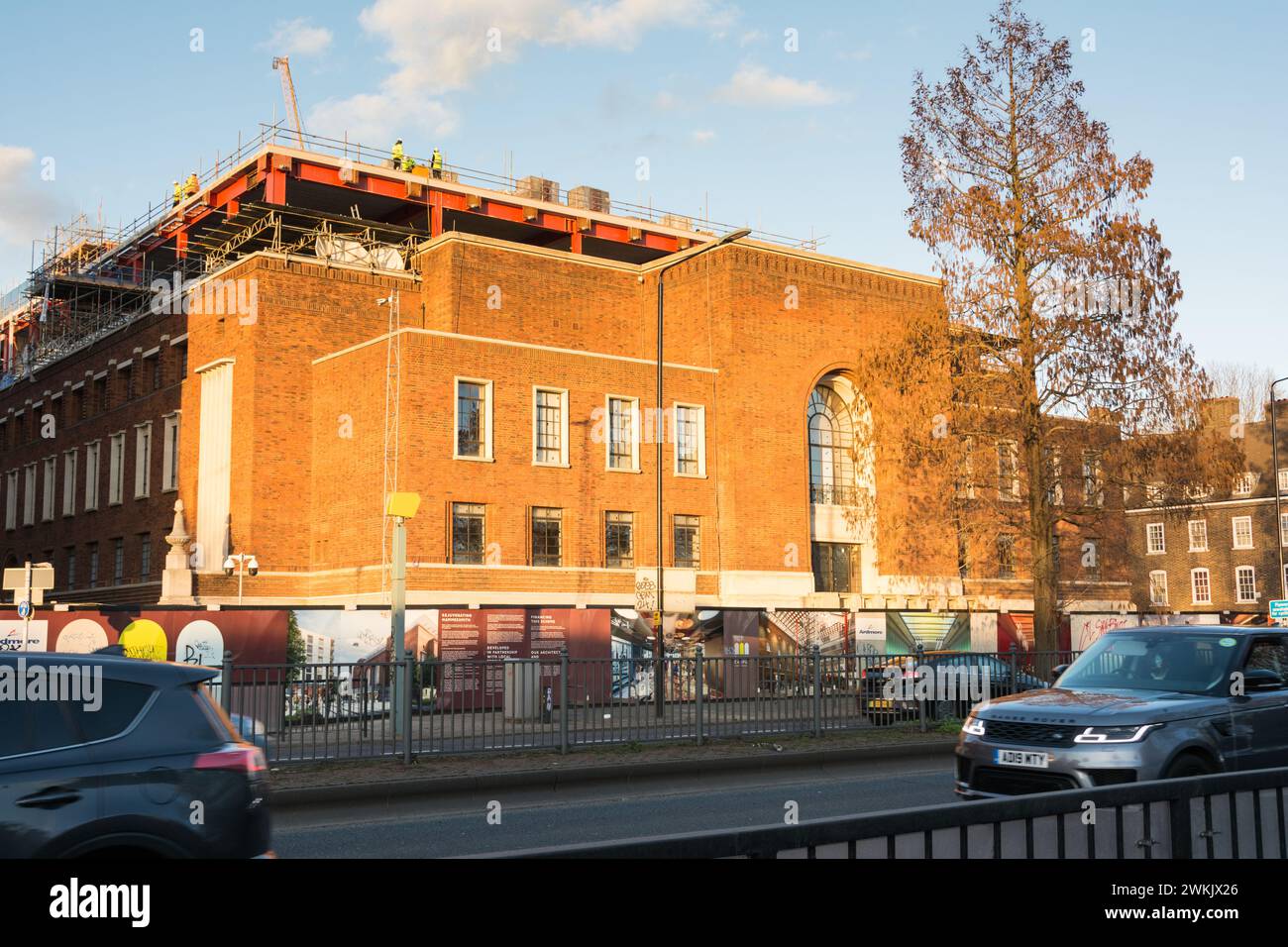 Workmen ontop of Hammersmith Town Hall during redevelopment, Great West