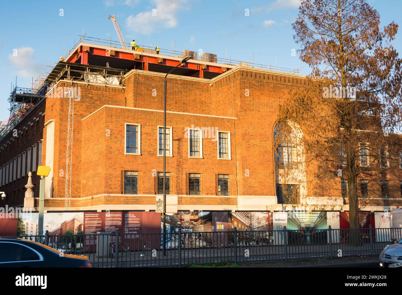 Workmen ontop of Hammersmith Town Hall during redevelopment, Great West