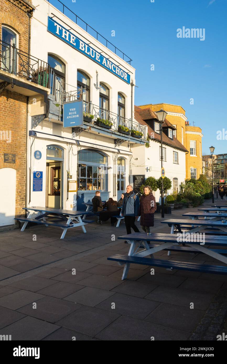 People walking outside famous Blue Anchor public house on the banks of the River Thames in Hammersmith, southwest London, England, UK Stock Photo