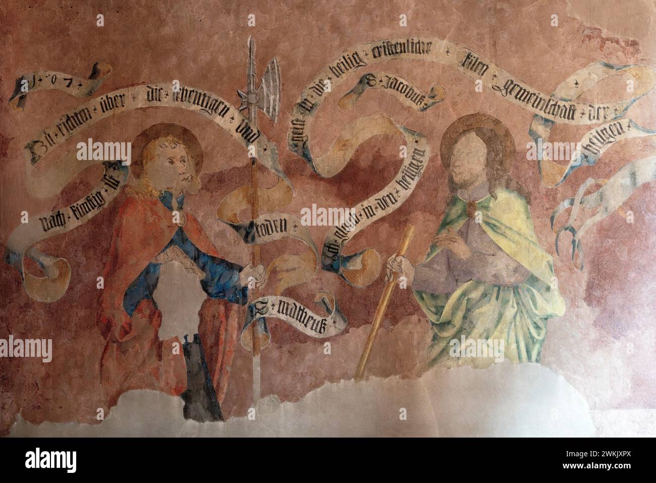 The church of  Saint Arbogast in Muttenz. The fresco in west and north part of nave depict the apostles surrounded by letter bands.  The church of  Sa Stock Photo
