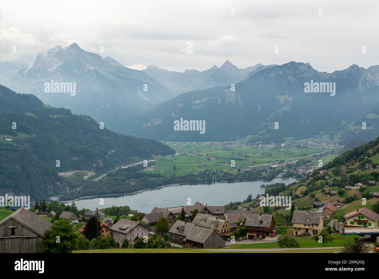 Walensee Background View over Walensee, Switzerland, with mist and mountains in the ...