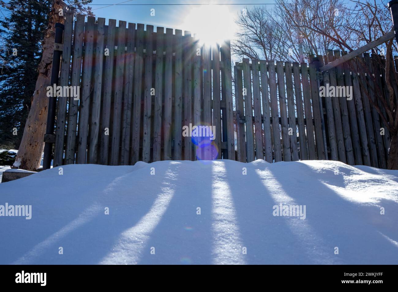 Sun Rising Over Fence Sun rise over the fence Stock Photo - Alamy