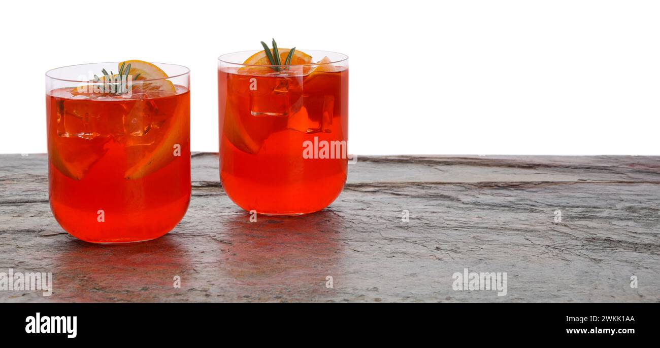 Aperol spritz cocktail, orange slices and rosemary in glasses on grey ...