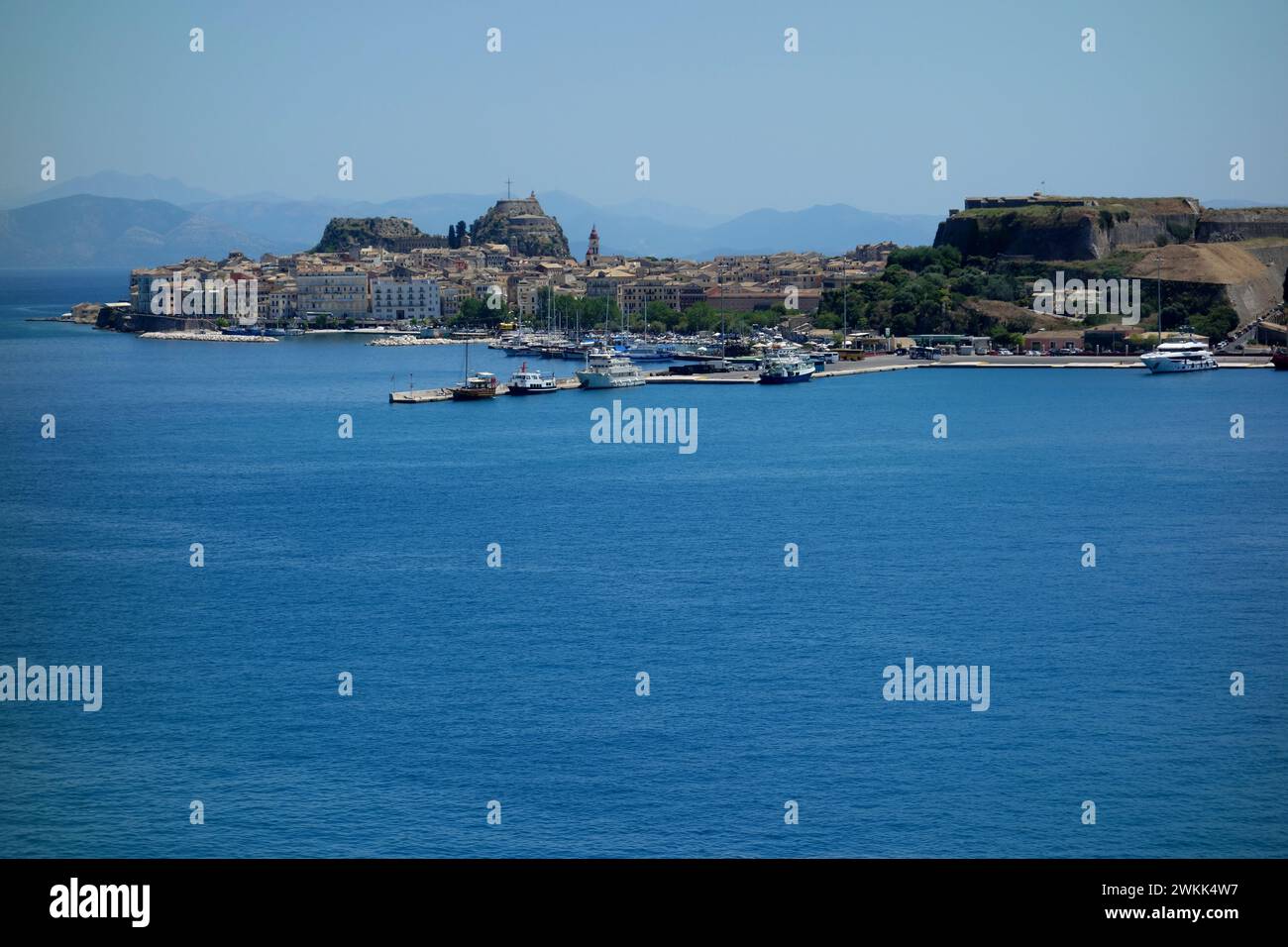 The Old and New Fortresses by above the Old Port on the Seafront in Corfu Town from the Sea, Greece, EU. Stock Photo