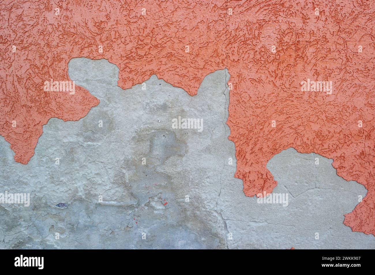 Peeling plaster on a house wall, structural damage Stock Photo