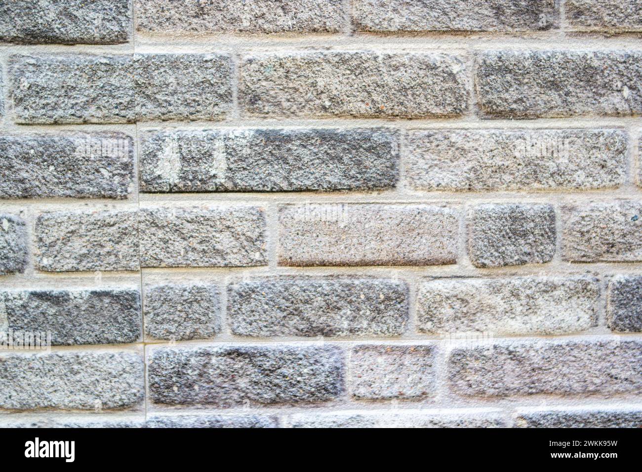 gray stone wall background with cement Stock Photo