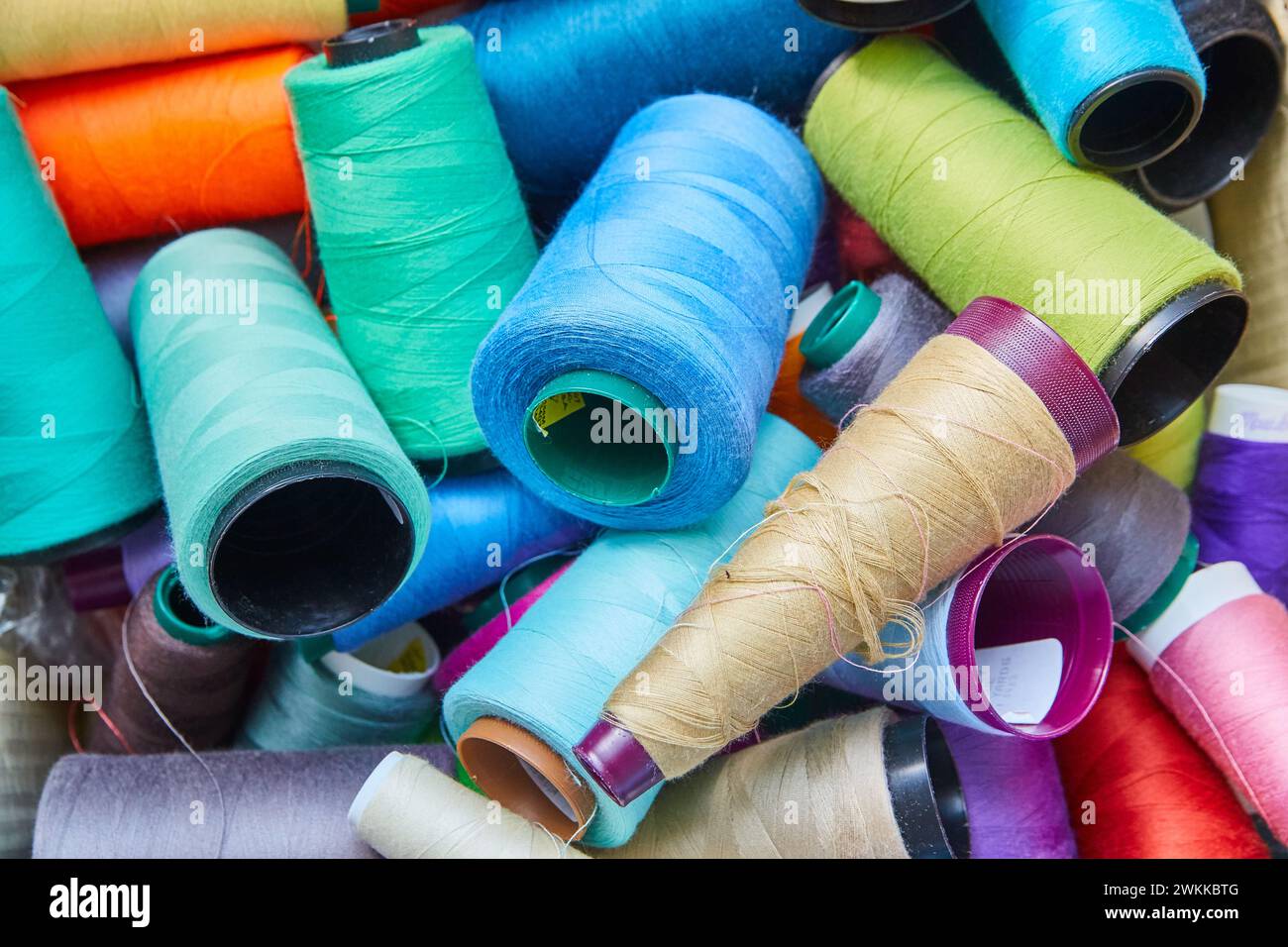 Colorful Thread Spools in Disarray Close-Up Stock Photo