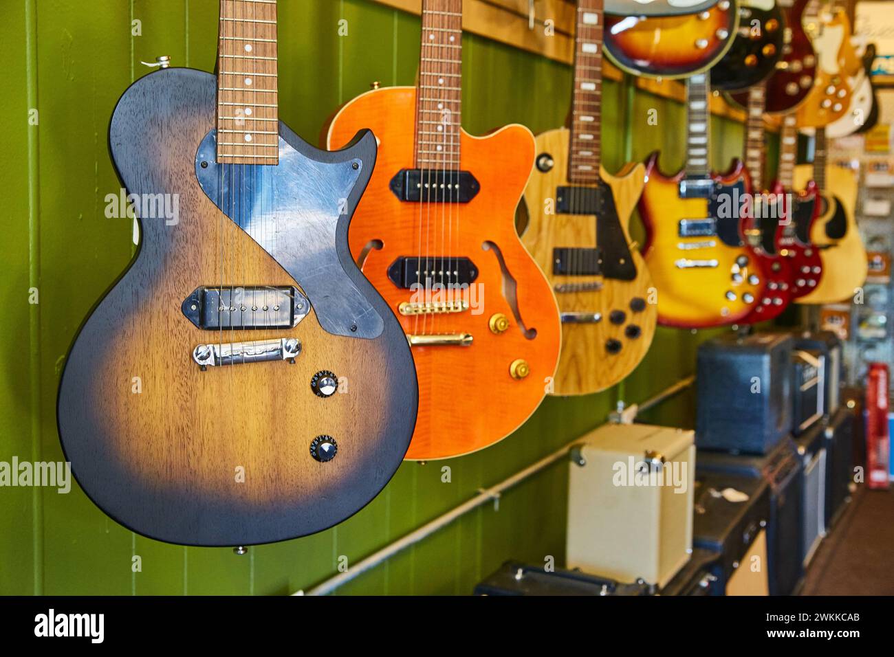 Electric Guitars on Display in Music Shop EyeLevel View Stock Photo