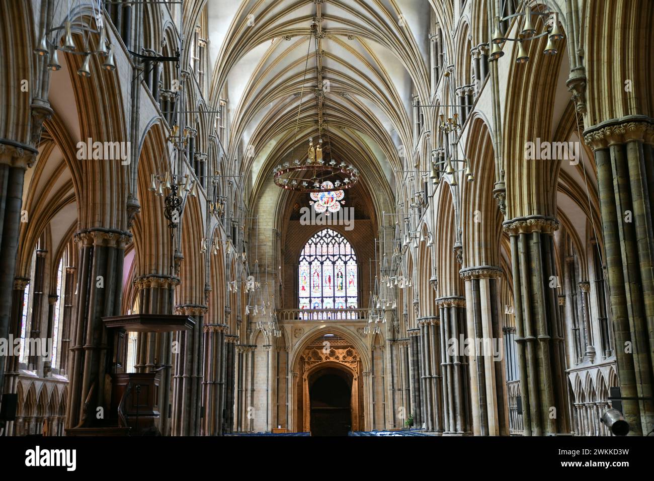 View of the nave of Lincoln Cathedral, looking west towards the entrance doors, Lincolnshire, England Stock Photo