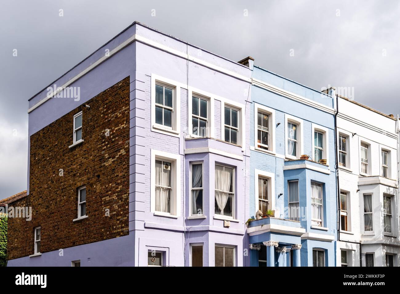 Traditional houses in Notting Hill neighborhood in London. Colorful pastel houses Stock Photo