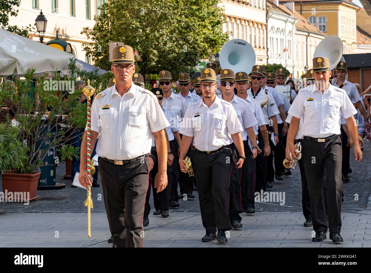 Military band marches down the street in VIII. at the Richard Fricsay Regional Military Band Festival. Szekesfehervar, Hungary - August 18, 2022. Stock Photo