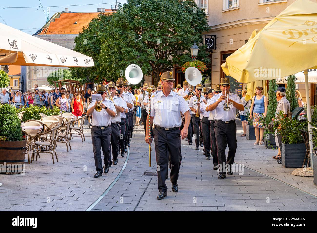 Military band marches down the street in VIII. at the Richard Fricsay Regional Military Band Festival. Szekesfehervar, Hungary - August 18, 2022. Stock Photo